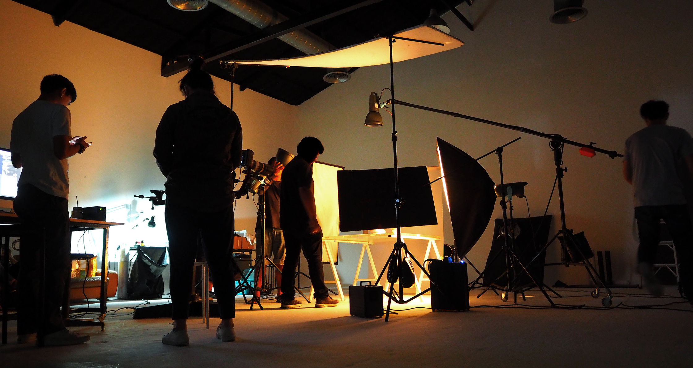 Silhouetted Production Team Shooting Video 